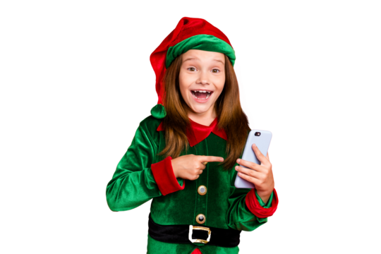 Portrait of amazed elf in hat with long red head point at her modern technology true user show like on her posts wear green costume cap isolated over red background