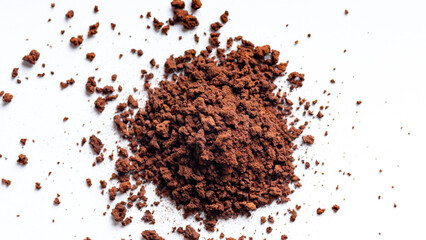 Top shot of instant coffee granules on a white background.