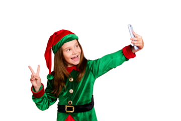 Portrait of lovely elf in hat with red head making selfie v-signs wearing green fairy costume hat cap isolated over red background