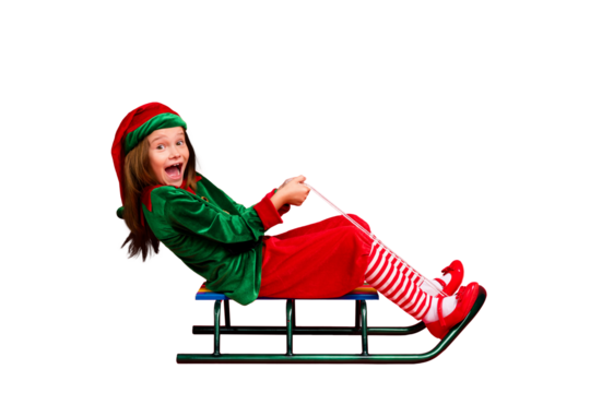 Full size profile side photo of crazy elf in green cap with red long hairstyle screaming sledding wearing elf costume isolated over red background