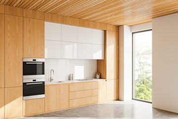 Stylish home kitchen interior with cooking cabinet and panoramic window