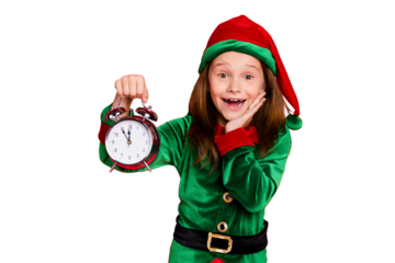 Close-up portrait of her she nice attractive cheerful cheery amazed delighted glad funny pre-teen elf holding in hands clock twelve midnight isolated over bright vivid shine red background