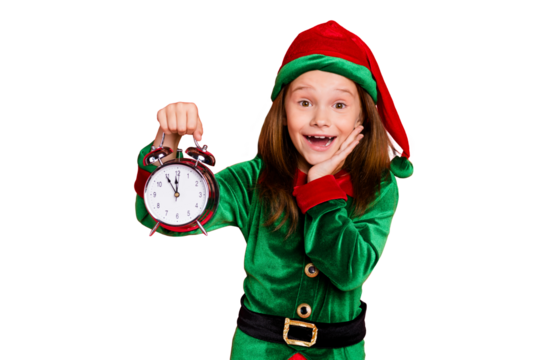 Close-up portrait of her she nice attractive cheerful cheery amazed delighted glad funny pre-teen elf holding in hands clock twelve midnight isolated over bright vivid shine red background