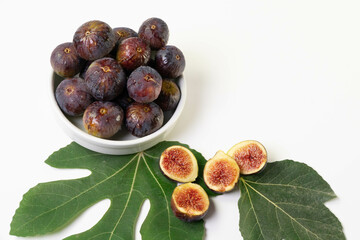 Organic figs, freshly harvested and cut into fig leaves