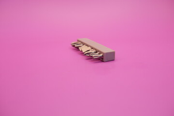 a set of screwdriver bits isolated on purple background