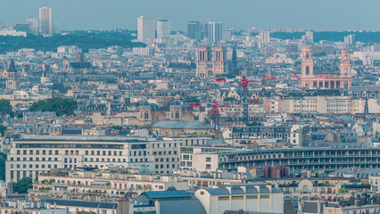 Obraz premium Aerial panorama above houses rooftops in a Paris day to night timelapse