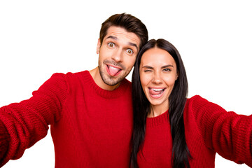 Close up photo of cheerful spouses grimace take self portrait wear red sweater isolated over yellow background