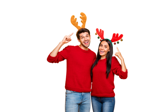 Portrait of charming spouses point at their deer handband reccomend product wear red pullover denim jeans isolated over yellow background