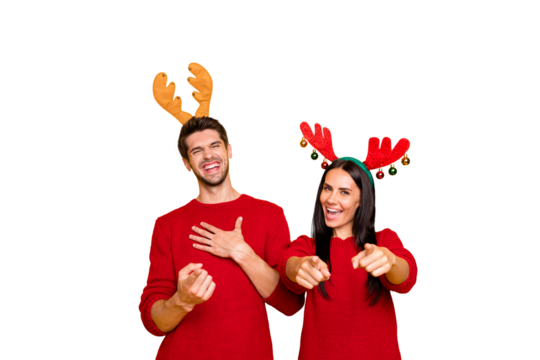 Portrait of cheerful man and woman laugh tease direct with index finger wear red sweater isolated over yellow background