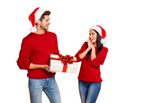 Portrait of handsome man give package for his impressed sweetheart screaming wow omg wear red cap pullover denim jeans isolated over yellow background