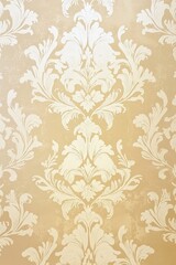 A classic damask pattern in a subdued shade of cream on a pale gold background, radiating timeless elegance