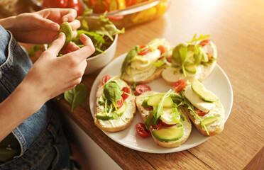 Girl with vegetables at kitchen