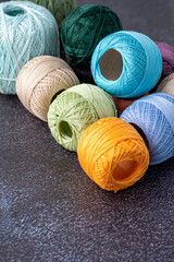 Multicolor yarn for knitting, knitting needles and scissors. Home storage concept and hobby.Raffia is an organic, ecological, wood fiber that is easy to crochet.