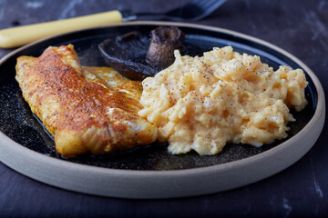 Spicy fish fillet with scrambled eggs and mushroom.