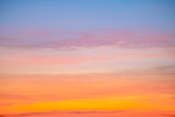 Fototapeta premium Beautiful , luxury soft gradient orange gold clouds and sunlight on the blue sky perfect for the background, take in everning,Twilight, Large size, high definition landscape photo