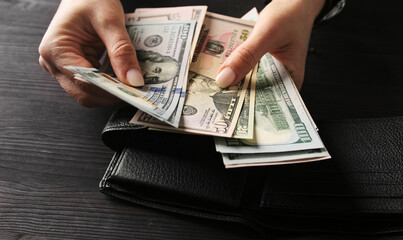 Woman Counting Her Cash Savings In Usa Dollar Bills © Ievgen Skrypko