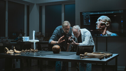 Modern archaeological lab: Two archaeologists or scientists photograph fossil specimen collection...