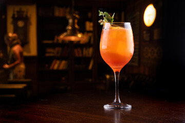 aperol spritz cocktail glass close up on front mint isolated close up flavored ice blurred background