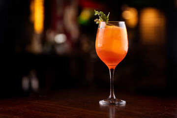 aperol spritz cocktail glass close up on front mint isolated on blurred background