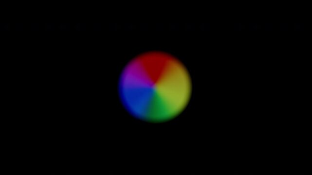 Cyclically Expanding Rainbow Orb, with soft, blurred segments in multiple colors, dynamically increasing and decreasing in size to show ongoing loading.