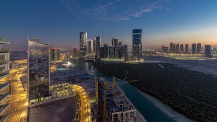 Buildings on Al Reem island in Abu Dhabi day to night timelapse from above. © HyperlapsePro