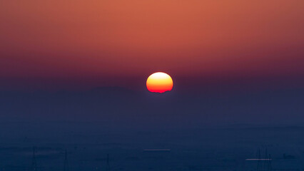 Beautiful sunrise in lonely desert and mountain in the background timelapse, Ajman, UAE