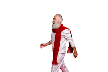 Profile side view of his he nice attractive well-dressed gray-haired man walking going motion movement coming December isolated over bright vivid shine red background