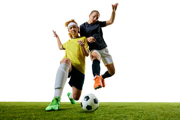 Two determined women, mid-20s, soccer players, captured mid-stride on green field, each pushing their limits in fast-paced, competitive match. Concept of sport, competition, tournament, games, event.