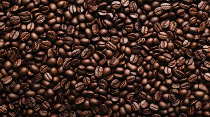Obraz premium view from above of a background depicting two dark brown, aromatic coffee beans 