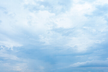 Fototapeta premium Bright blue sky with fluffy white clouds on a sunny summer day