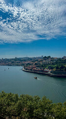 Naklejka premium The Douro River flowing through the beautiful city of Porto, Portugal
