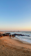 Beautiful sunset in Porto casting a warm glow over the beach - Portugal
