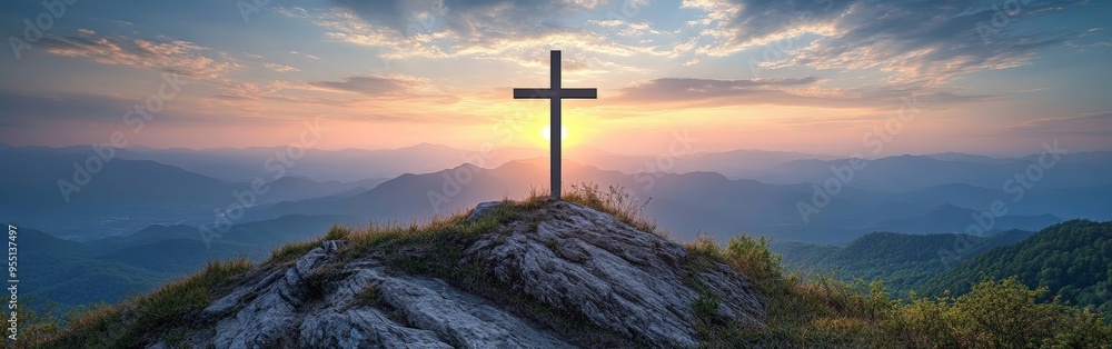 Wall mural serene sunrise over mountain cross