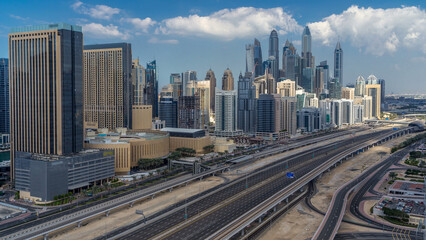 Fototapeta premium Dubai Marina skyscrapers aerial top view with clouds from JLT in Dubai timelapse, UAE.