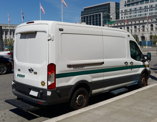 Sheriff's van parked in urban setting