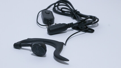 Black portable radio ht or walkie talkie in a white background