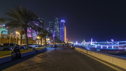 The skyline of Doha by night with starry sky seen from Corniche timelapse hyperlapse, Qatar