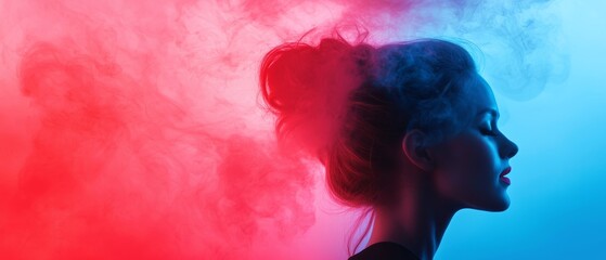 Fototapeta premium Artistic silhouette of a woman with colorful smoke background. Vibrant red and blue clouds create dramatic contrast.