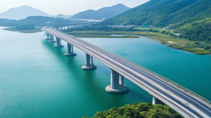 A scenic view of an expressway crossing a large bridge, with water or landscape below and the road stretching into the distance, highlighting infrastructure scale.
