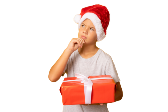 portrait of a pensive child boy holding a new gift isolated over transparent background.