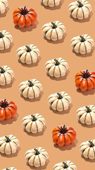 Pumpkin pattern creative on orange beige background vertical banner