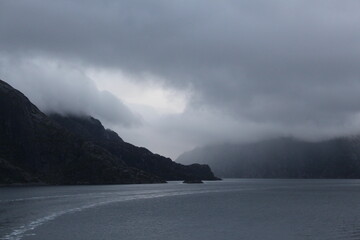Grey clouds and fog over mountains in the North Sea