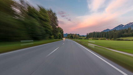 Asphalt road in Austria, Alps in a beautiful autumn day timelapse hyperlapse drivelapse