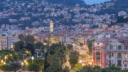 Obraz premium Evening aerial panorama of Nice day to night timelapse, France. Lighted Old Town little streets and Massena square after sunset