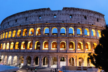Rome, Italy - April 09, 2024: View of the Roman Coliseum in Rome with tourists crowding its surroundings in Rome, Italy