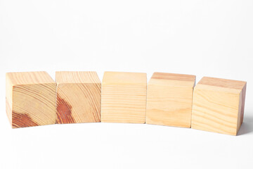 Many blank wooden cubes on white background