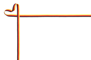 Heart made with ribbon in colors of German flag isolated on white, top view