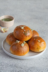Freshly baked buns (pampushki) with garlic and dill for the first course (soup). National Ukrainian dish, food. Selective focus.