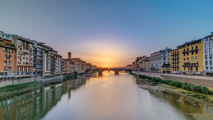 Cityscape view on Arno river with famous Holy Trinity bridge timelapse on the sunset in Florence