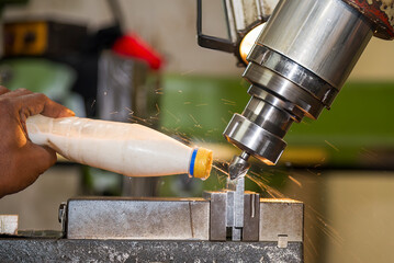 The angle milling process on NC milling machine with liquid coolant method.